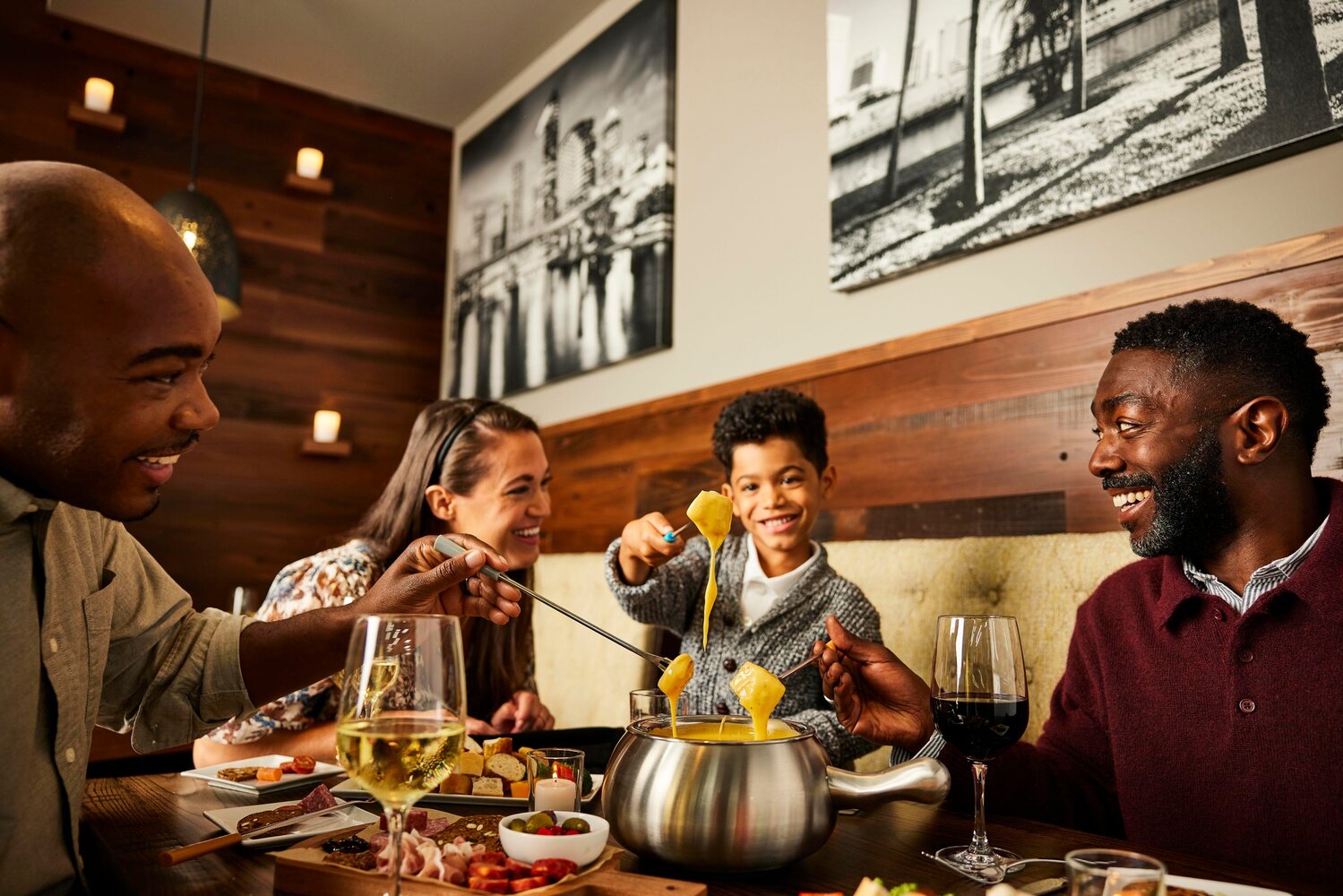 A company promotional photo shows the dining experience at The Melting Pot.